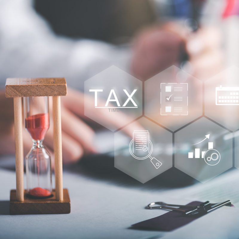 Businessman is managing documents and calculating tax rates and business finance budget. Effective tax deduction planning ideas for individuals and companies. document management system